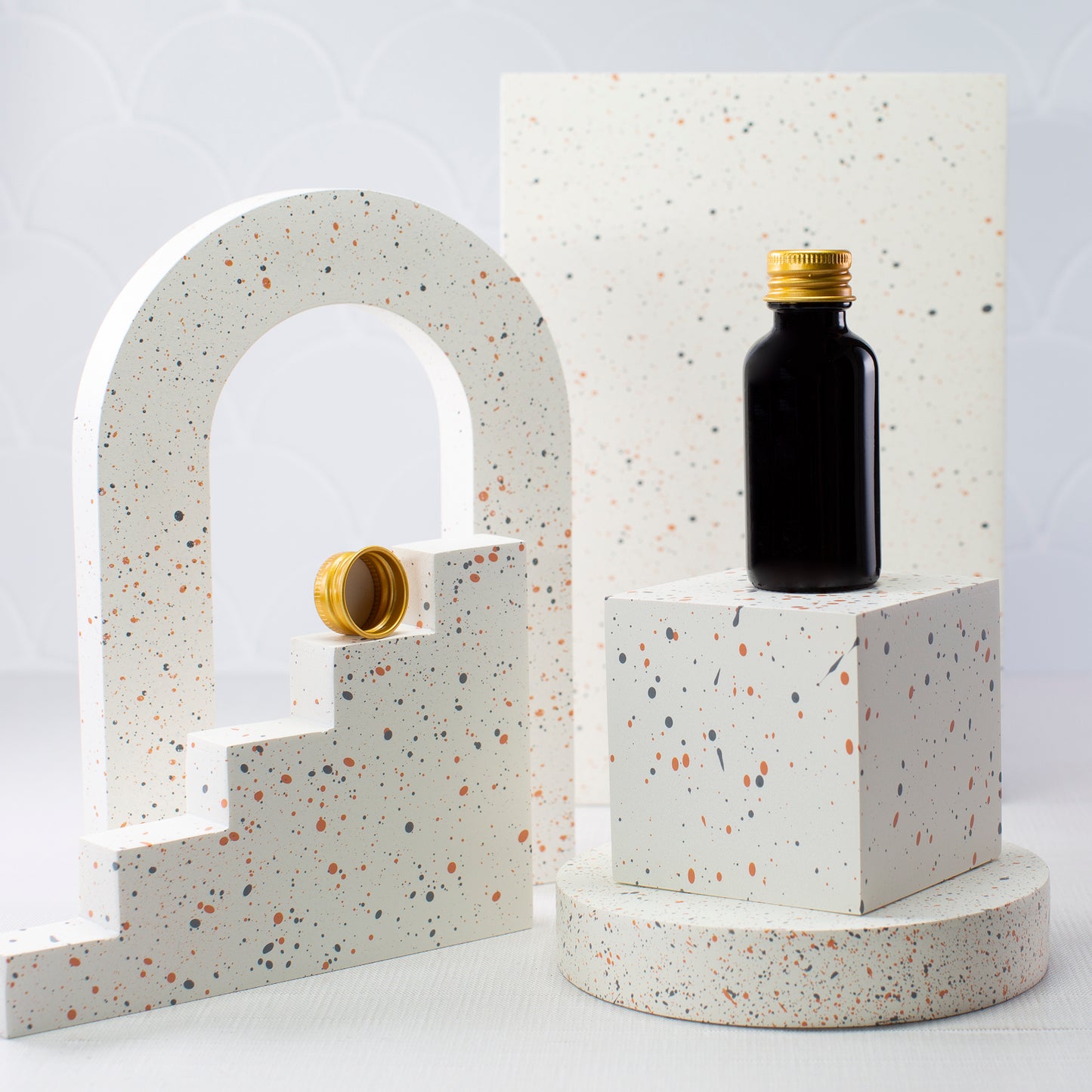1 oz Black Glass Bottle with 20-410 Gold Metal Cap