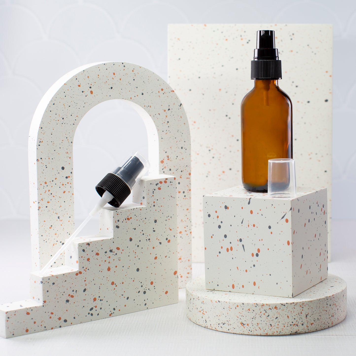 2 oz Amber Glass Bottle with 20-400 Black Treatment Pump