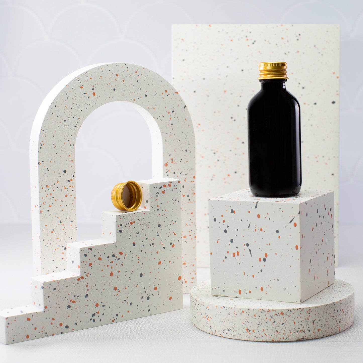 2 oz Black Glass Bottle with 20-410 Gold Metal Cap