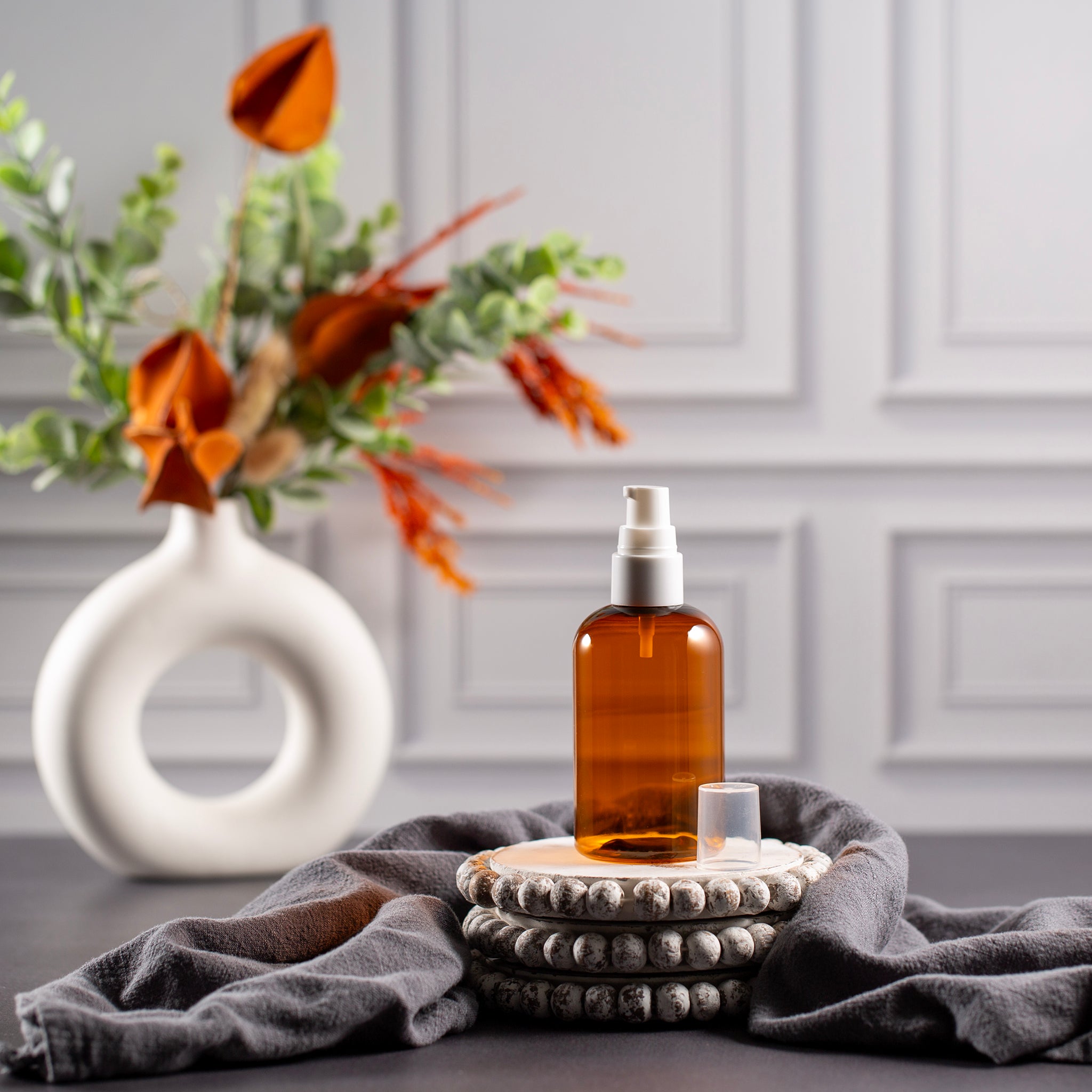 4 oz Amber PET Boston Round with 20410 White Treatment Pump Voyageur