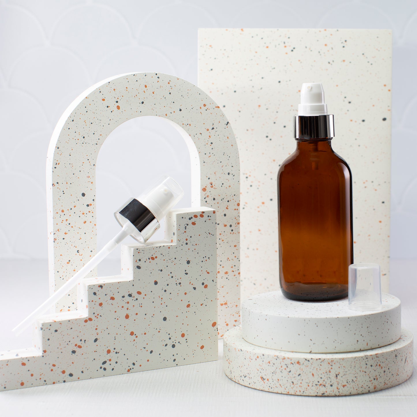 4 oz Amber Glass Bottle with 22-400 White Treatment Pump with Silver Shell