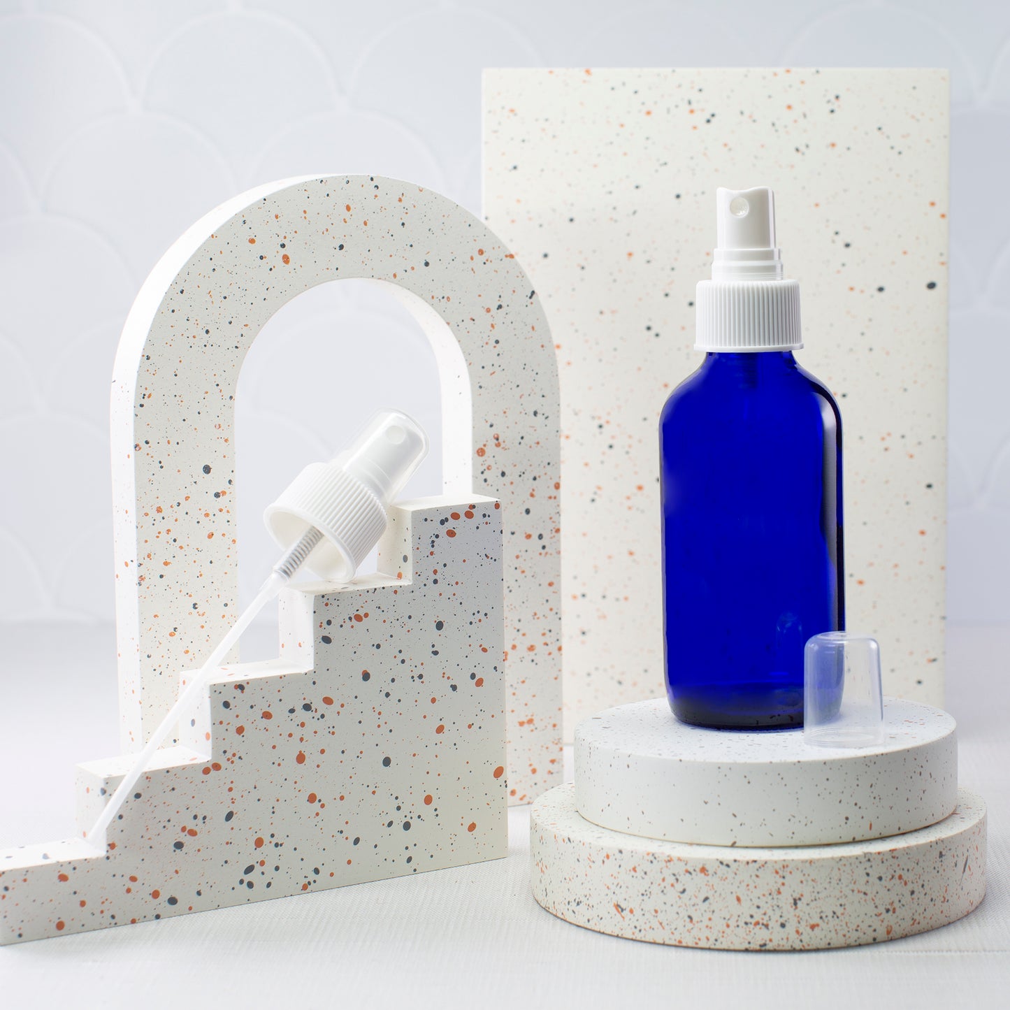 4 oz Blue Glass Boston Round Bottle with 24-410 White Fine Mist Sprayer