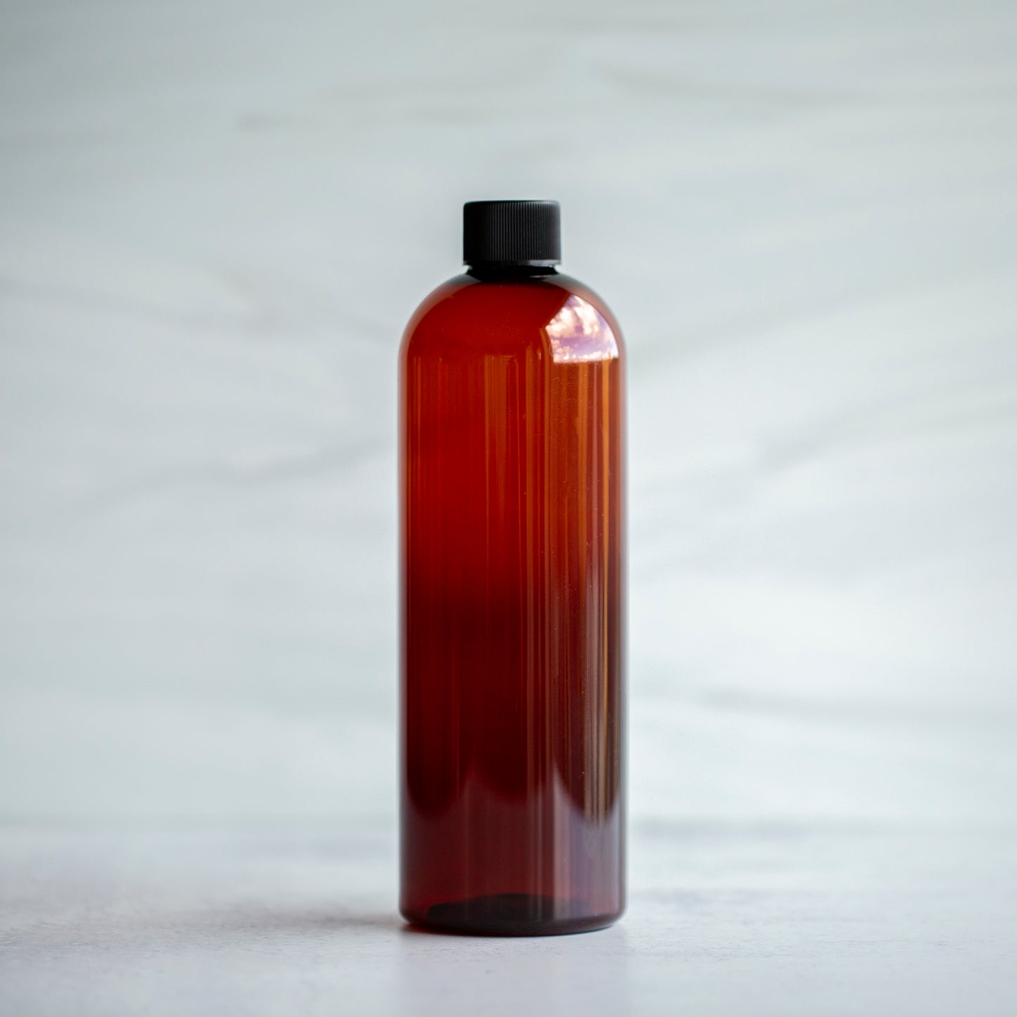 16oz Amber Bullet with Black Ribbed Cap