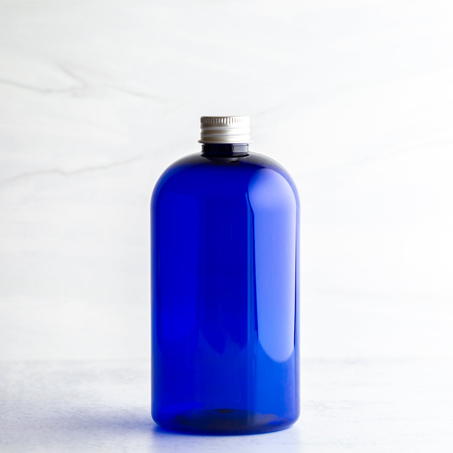 16 oz Blue Boston Round Bottle with 24-410 Aluminum Cap