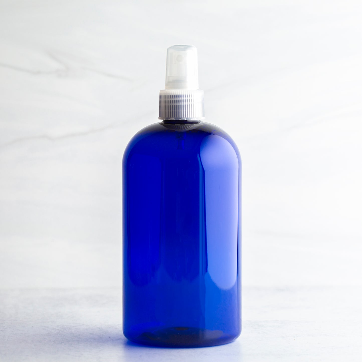 16 oz Blue Boston Round Bottle with 24-410 Natural Mister