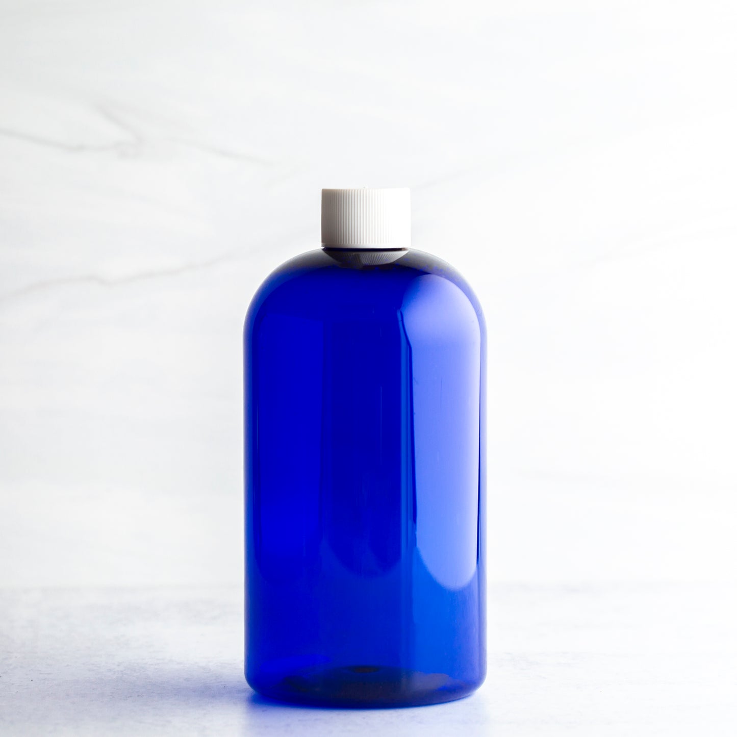 16 oz Blue Boston Round Bottle with 24-410 White Screw Cap