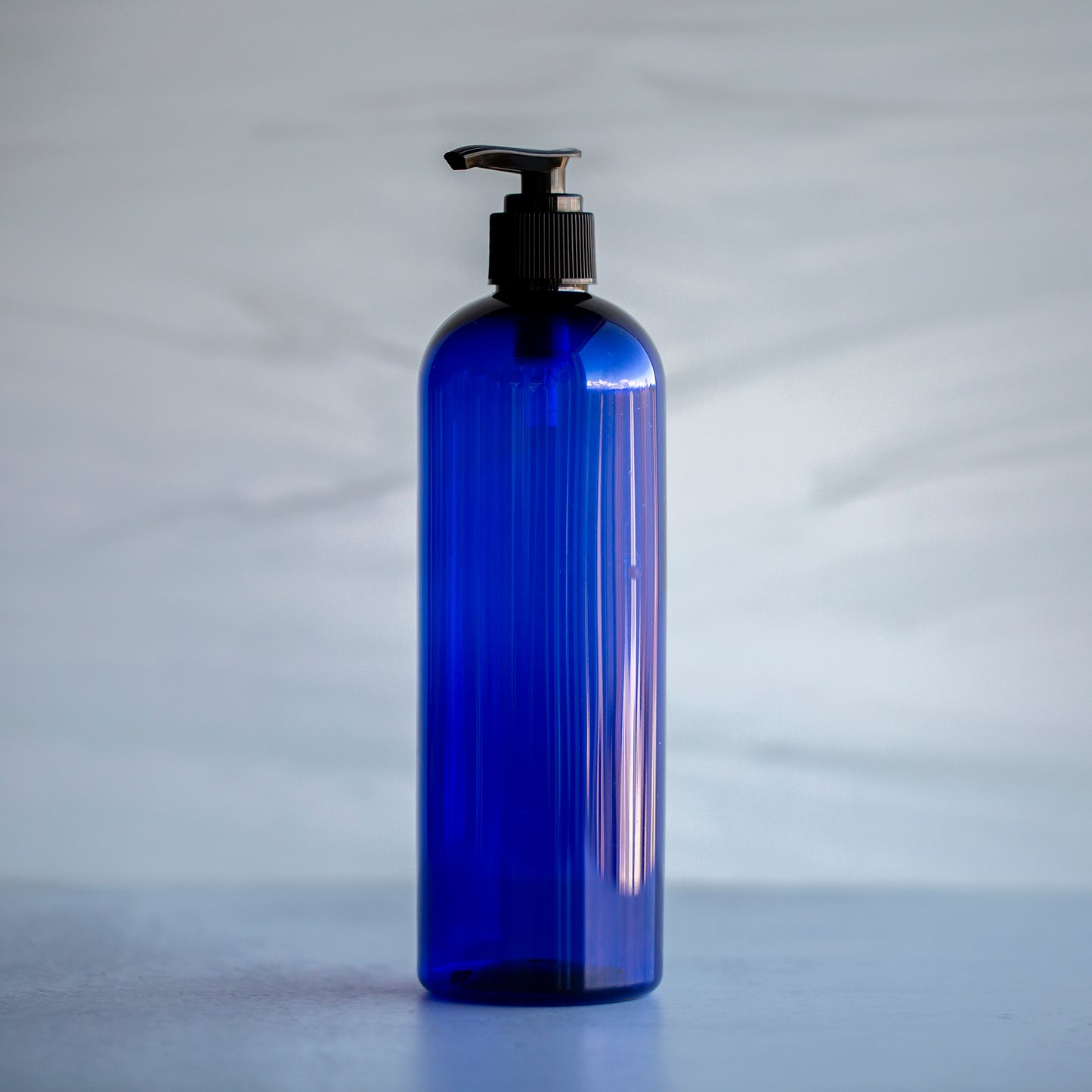 16 oz Blue Bullet Bottle with Black Pump