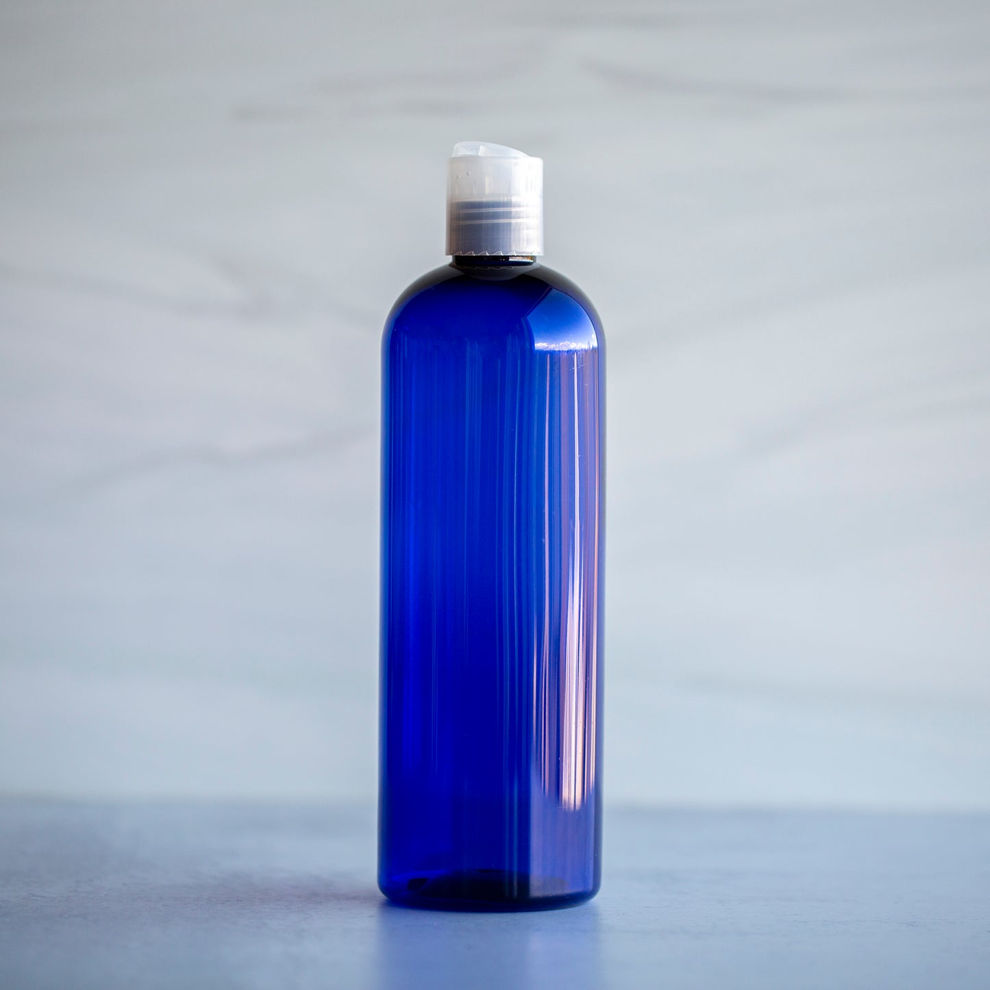 16 oz Blue Bullet Bottle with Natural Disc Cap