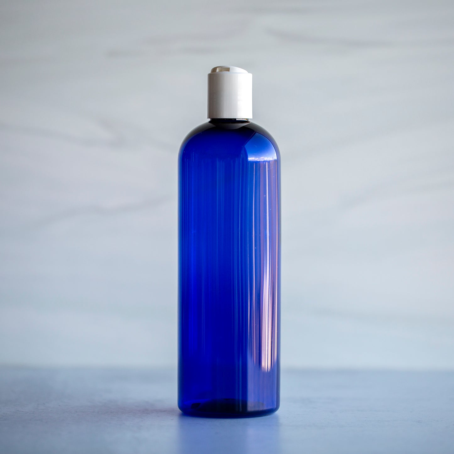 16 oz Blue Bullet Bottle with White Disc Cap