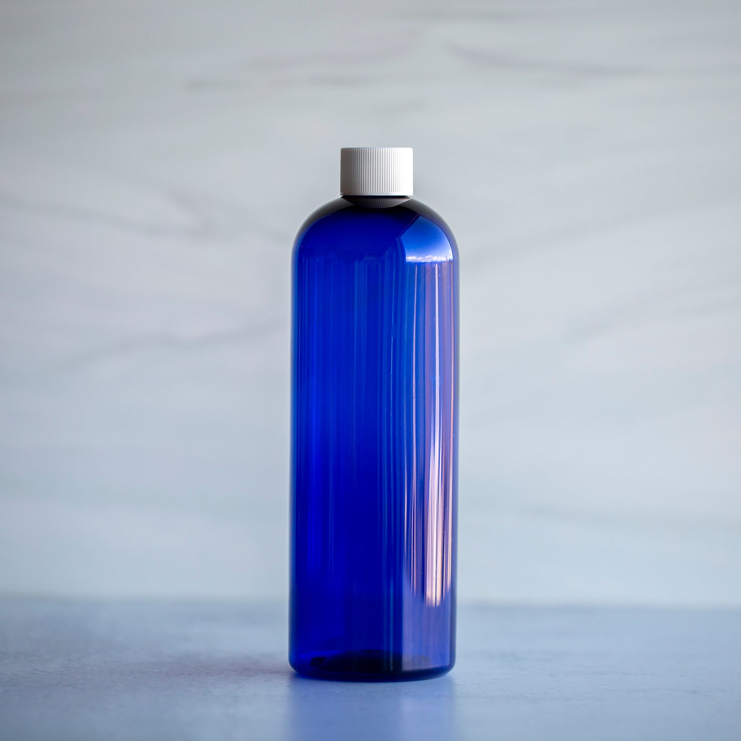 16 oz Blue Bullet Bottle with White Screw Cap