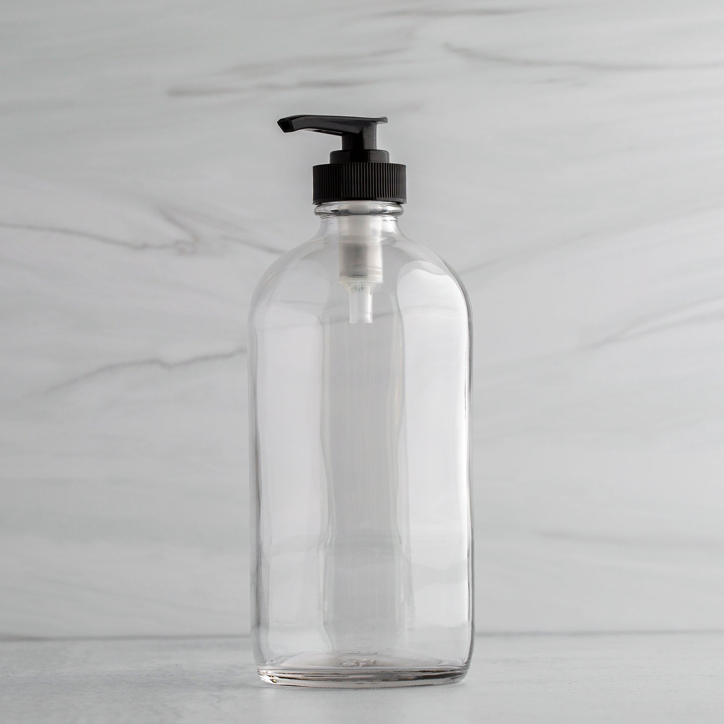 16 oz Clear Glass Bottle with Black Saddle Pump