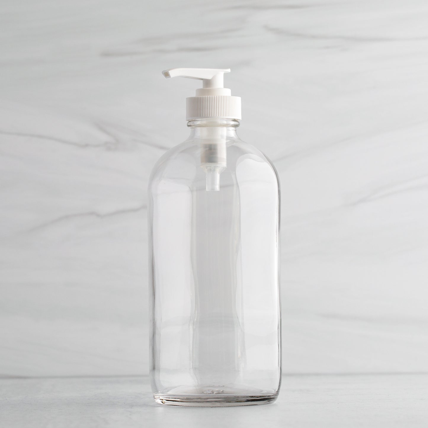 16 oz Clear Glass Bottle with White Saddle Pump