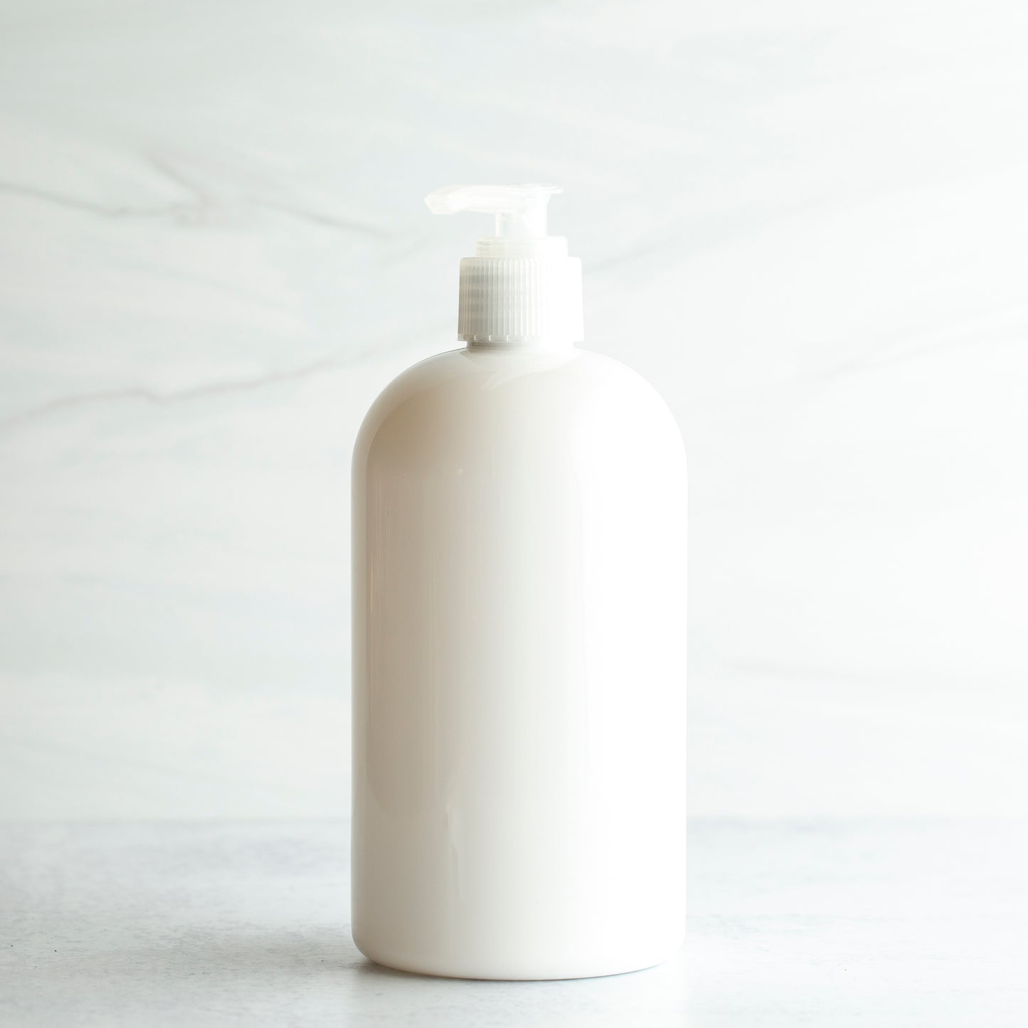 16 oz White PET Boston Round Bottle with 24-410 Natural Saddle Pump