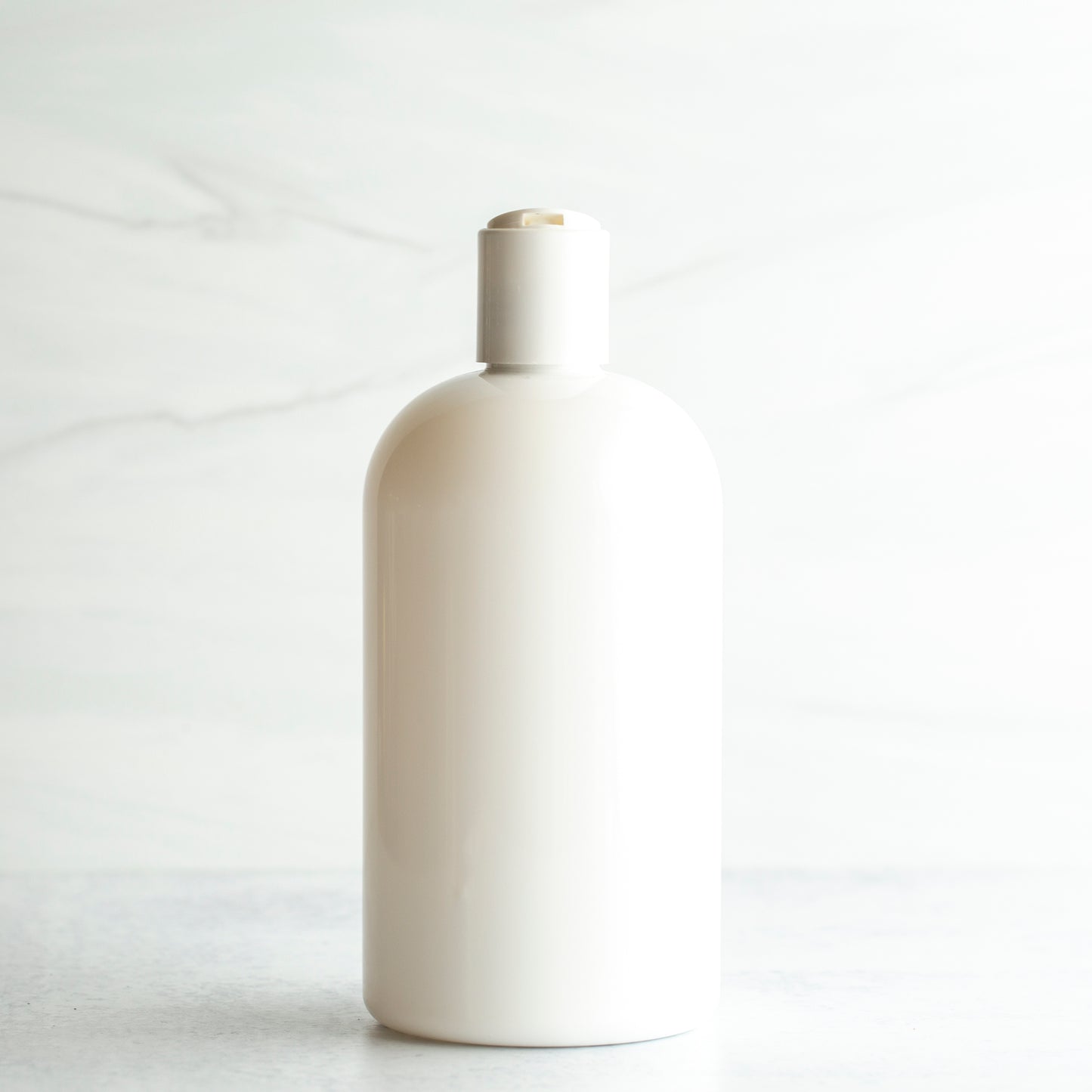 16 oz White PET Boston Round Bottle with 24-410 White Disc Cap