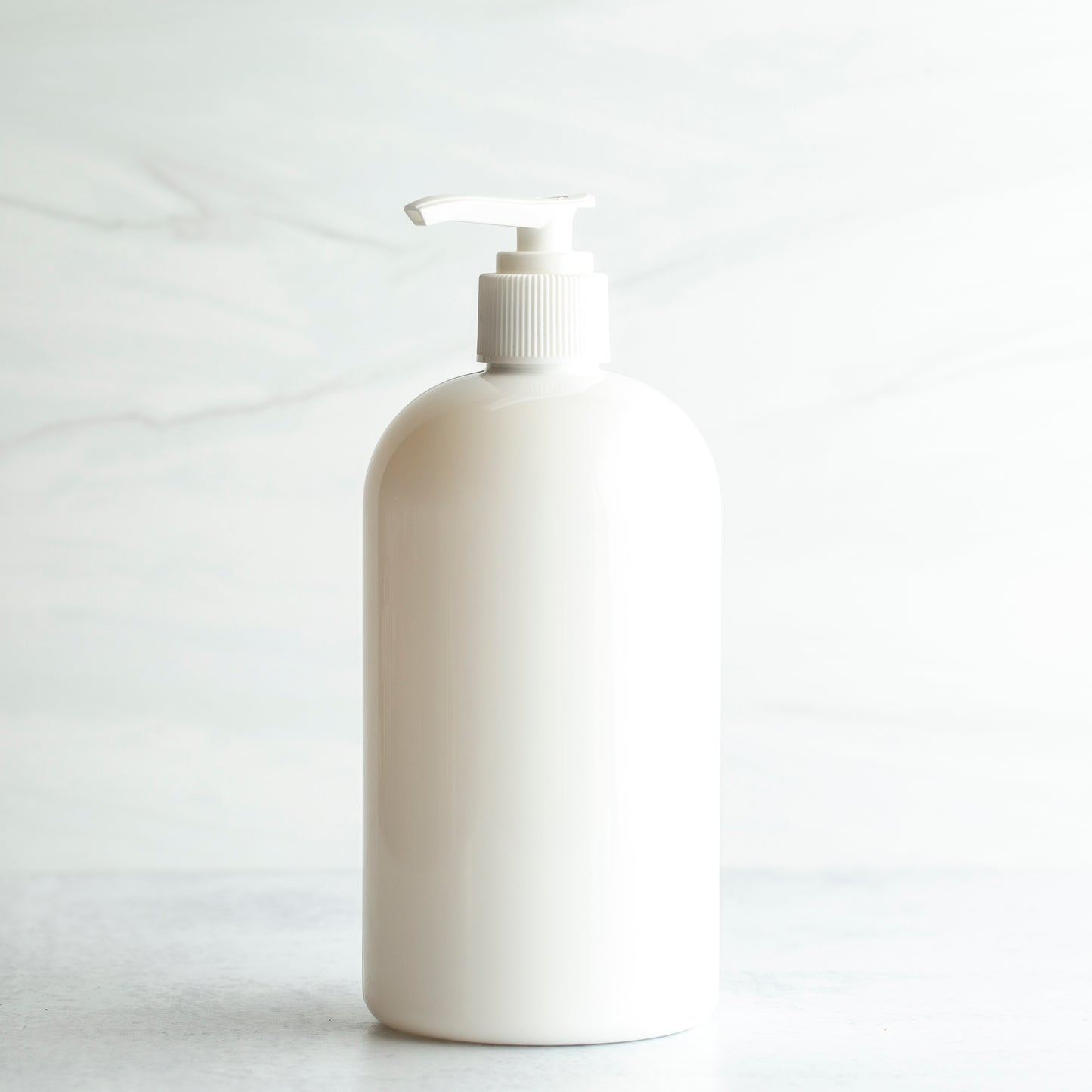 16 oz White PET Boston Round Bottle with 24-410 White Saddle Pump