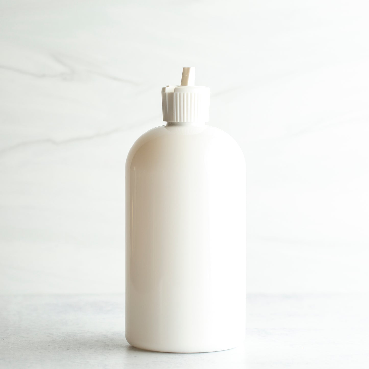 16 oz White PET Boston Round Bottle with 24-410 White Turret Cap