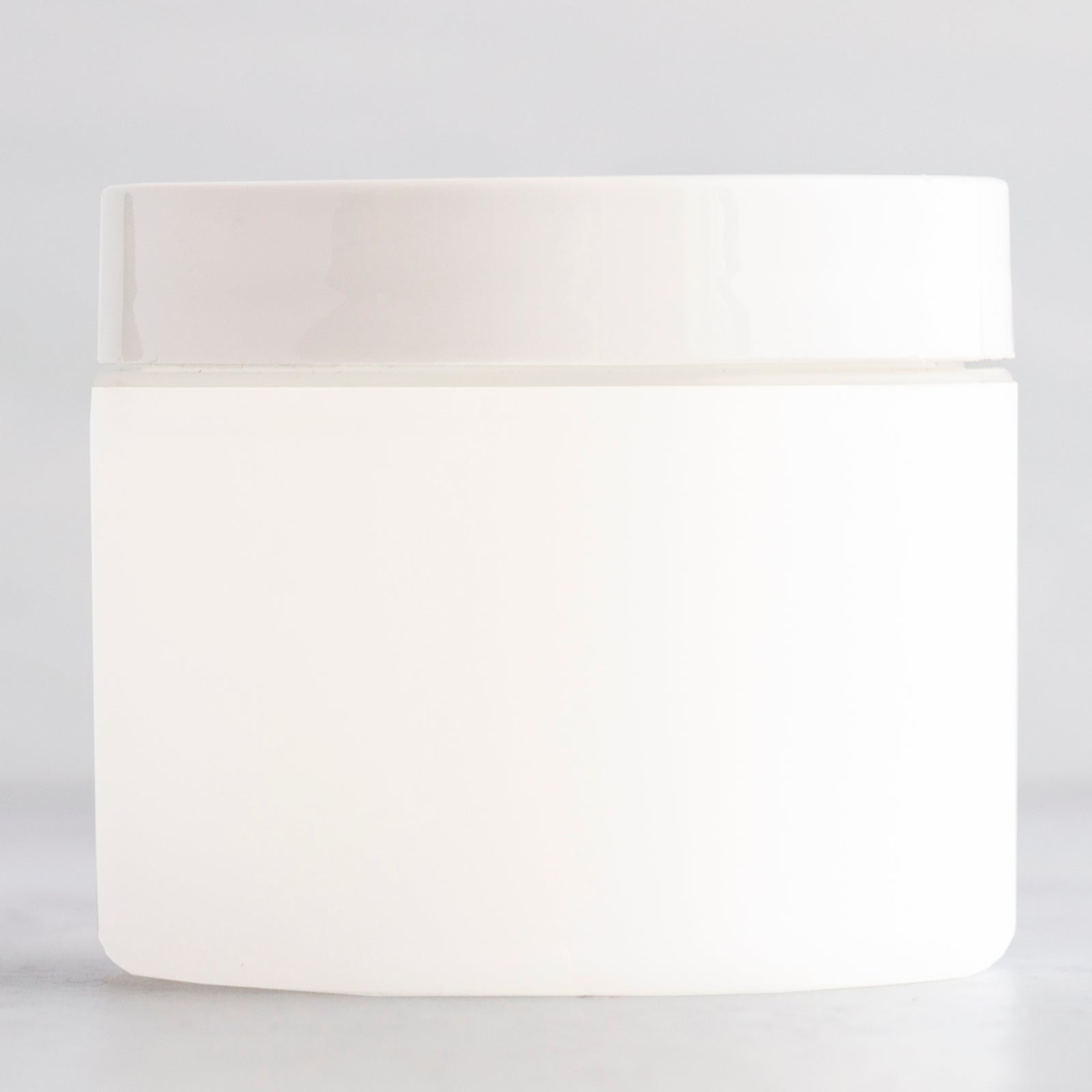 2 oz Frosted Straight Sided Plastic Jar with White Flat Gloss Cap