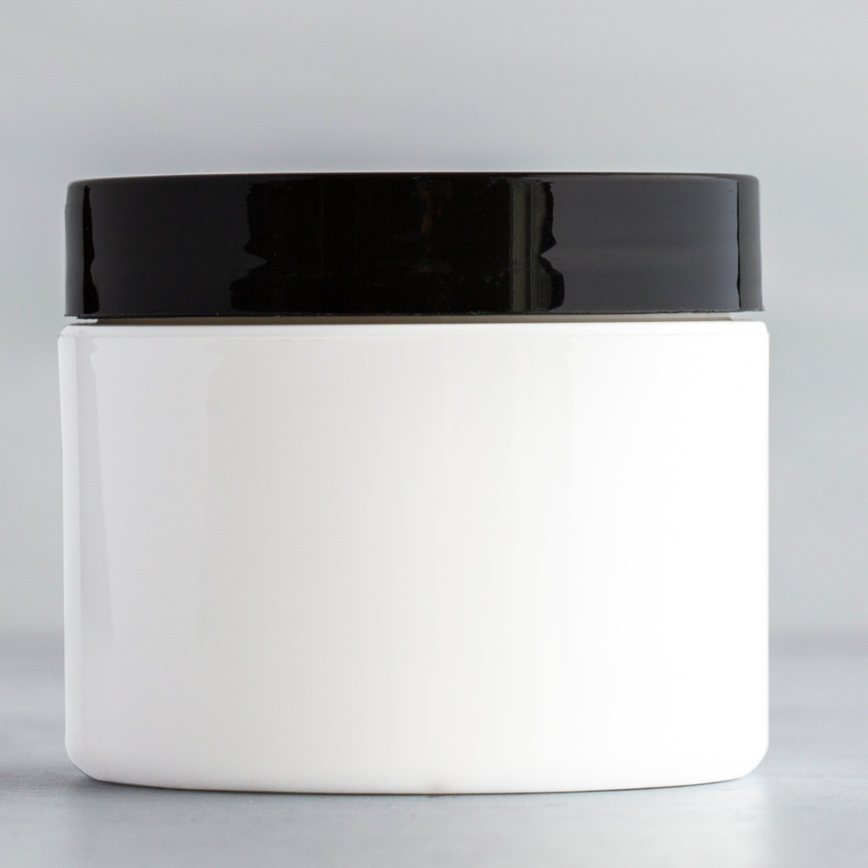 2 oz White Square Base Plastic Jar with Black Gloss Flat Cap