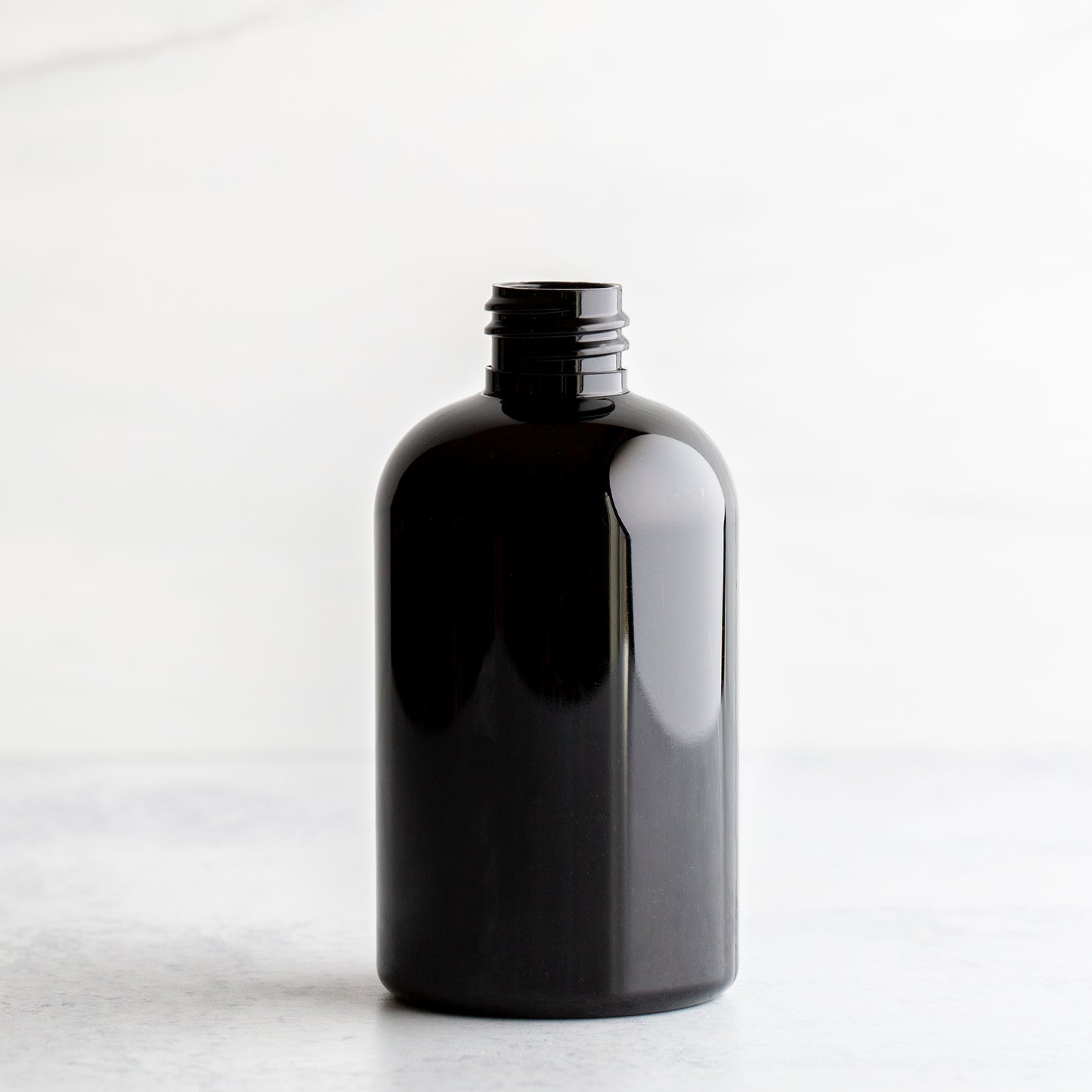 4 oz Black PET Boston Round Bottle Without Closure
