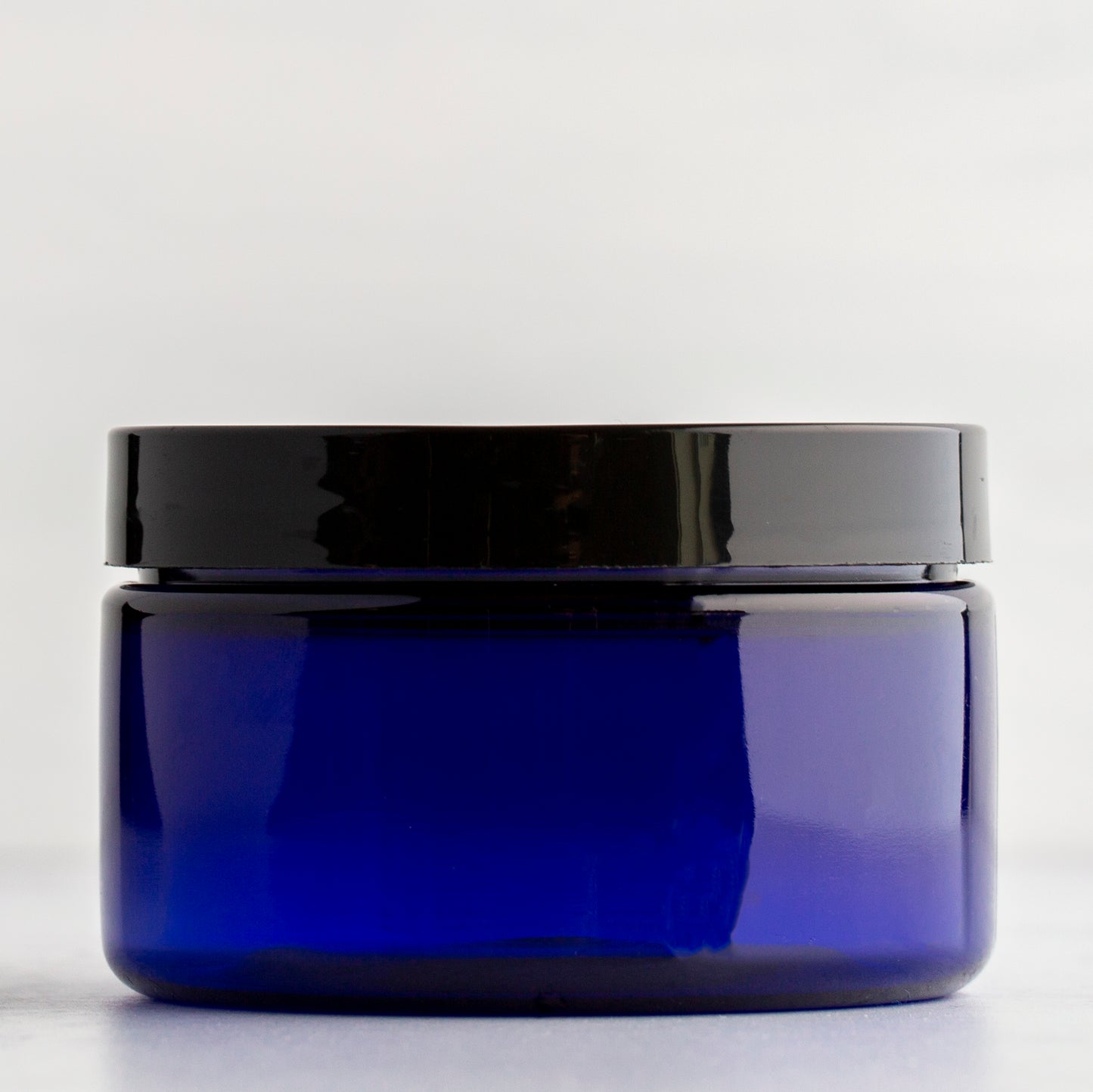 4 oz Blue Shallow Plastic Jar with Black Flat Gloss Cap