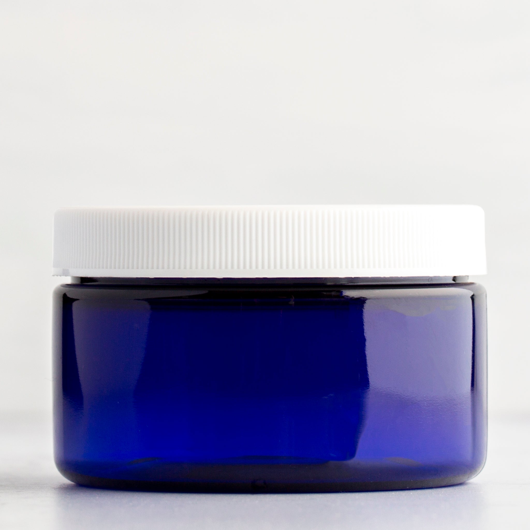 4 oz Blue Shallow Plastic Jar with White Ribbed Cap