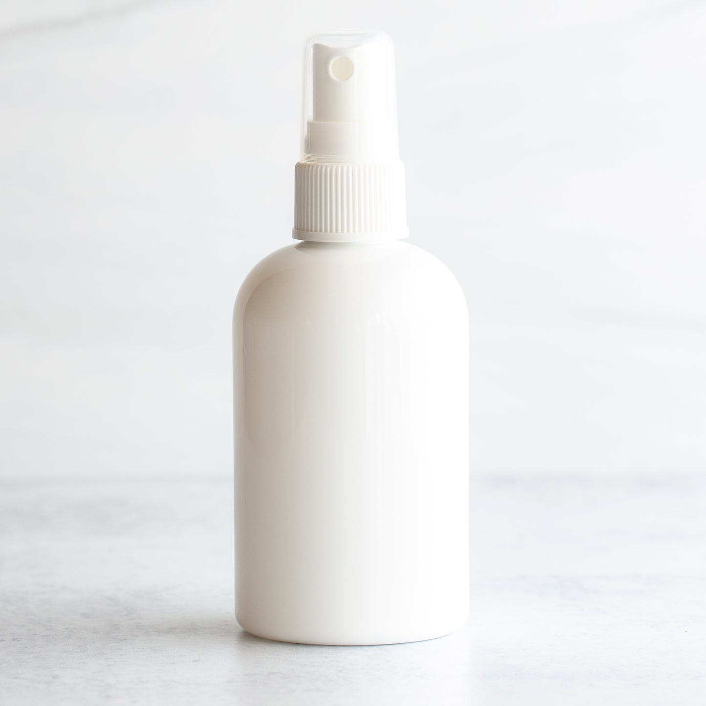4 oz White PET Boston Round Bottle with 20-410 White Fine Mist Sprayer