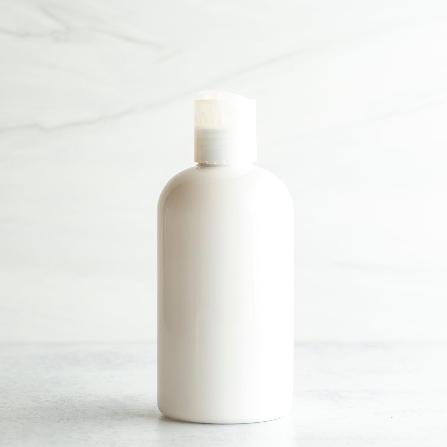 8 oz White PET Boston Round Bottle with 24-410 Natural Disc Cap