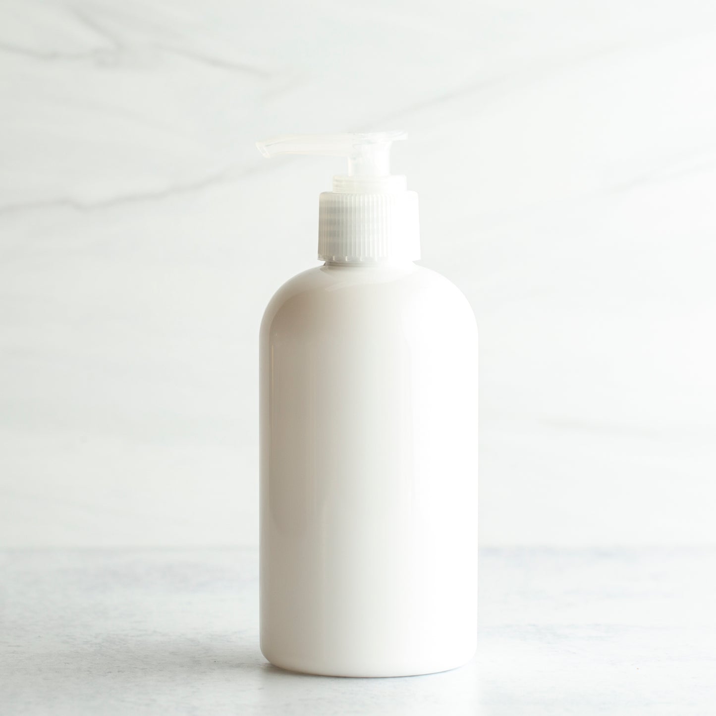 8 oz White PET Boston Round Bottle with 24-410 Natural Saddle Pump
