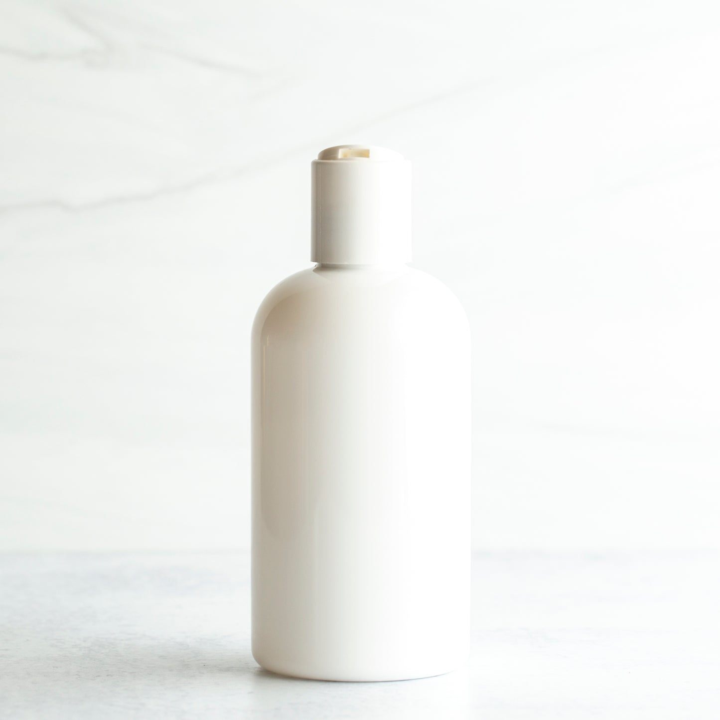 8 oz White PET Boston Round Bottle with 24-410 White Disc Cap