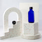 2 oz Blue Glass Boston Round Bottle with 20-400 Black Phenolic Cap
