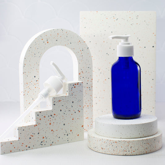 4 oz Blue Glass Boston Round Bottle with 24-410 White Saddle Pump