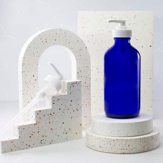 8 oz Blue Glass Boston Round Bottle with 28-400 White Saddle Pump