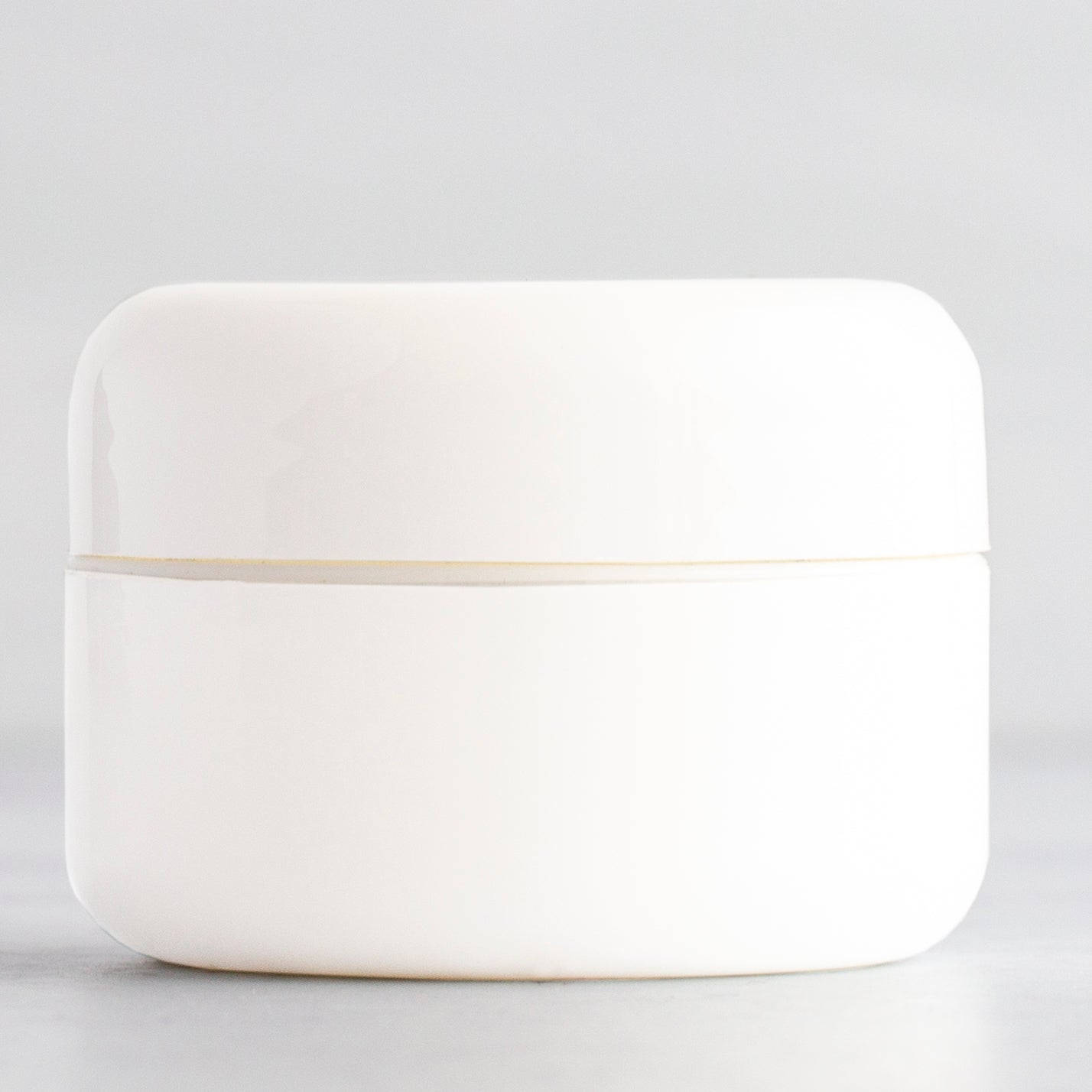 0.5 oz White Round Base Plastic Jar with White Dome Cap