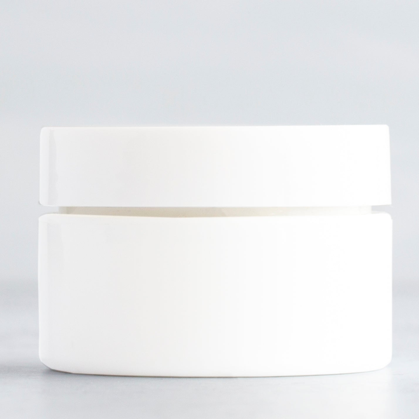0.5 oz White Square Base Plastic Jar with White Gloss Flat Cap