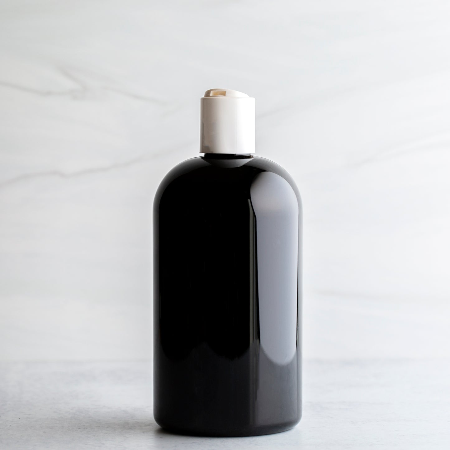 16 oz Black Boston Round Bottle White Disc