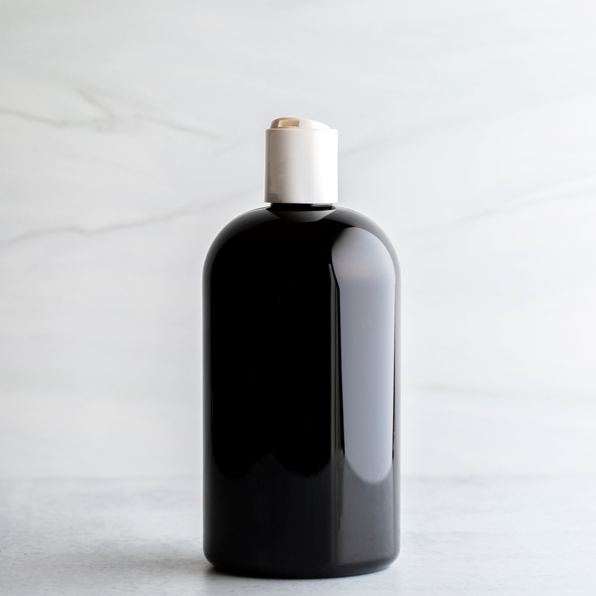 16 oz Black Boston Round Bottle White Disc