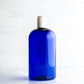 16 oz Blue Boston Round Bottle with 24-410 White Disc Cap