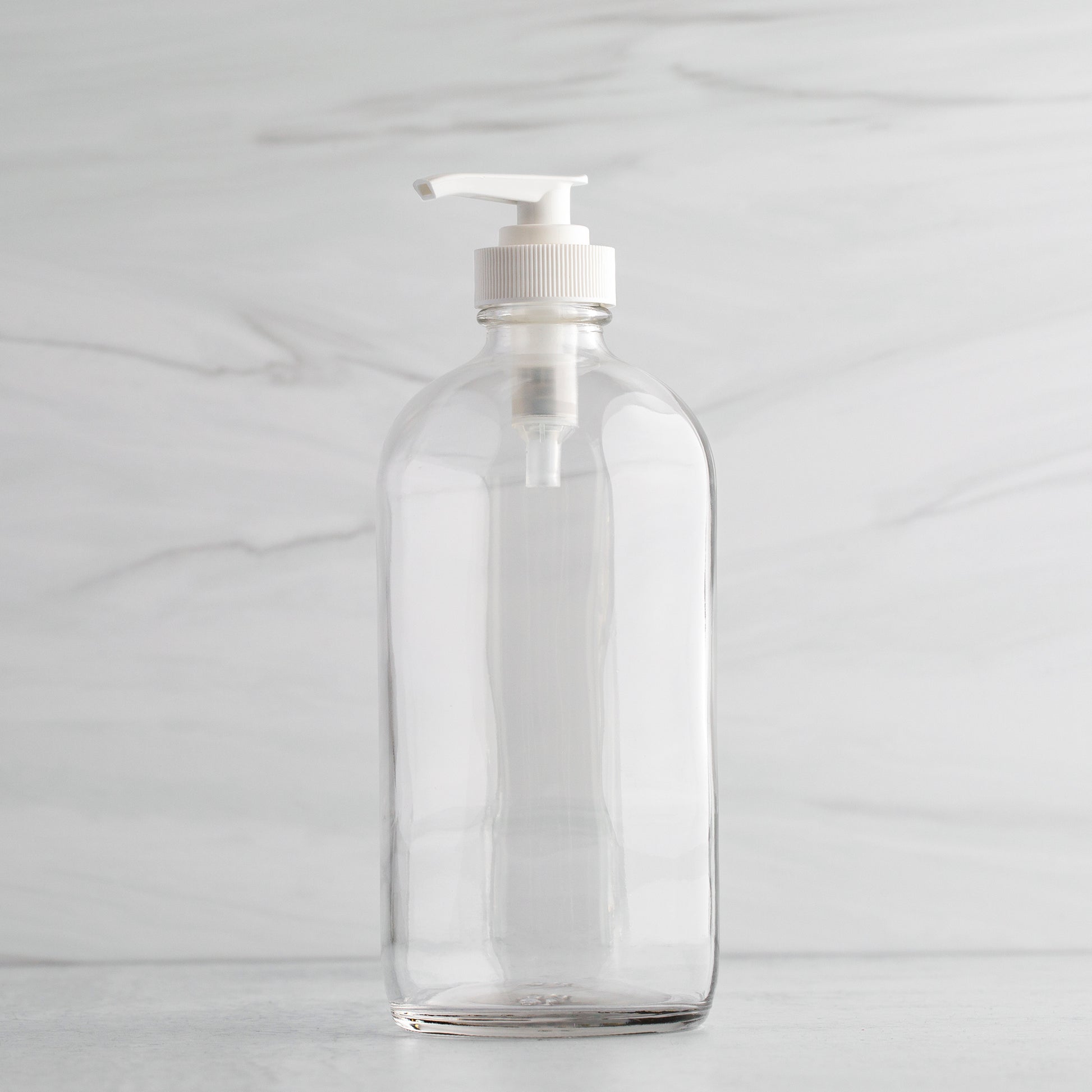 16 oz Clear Glass Bottle with White Saddle Pump