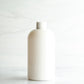 16 oz White PET Boston Round Bottle with 24-410 White Ribbed Cap