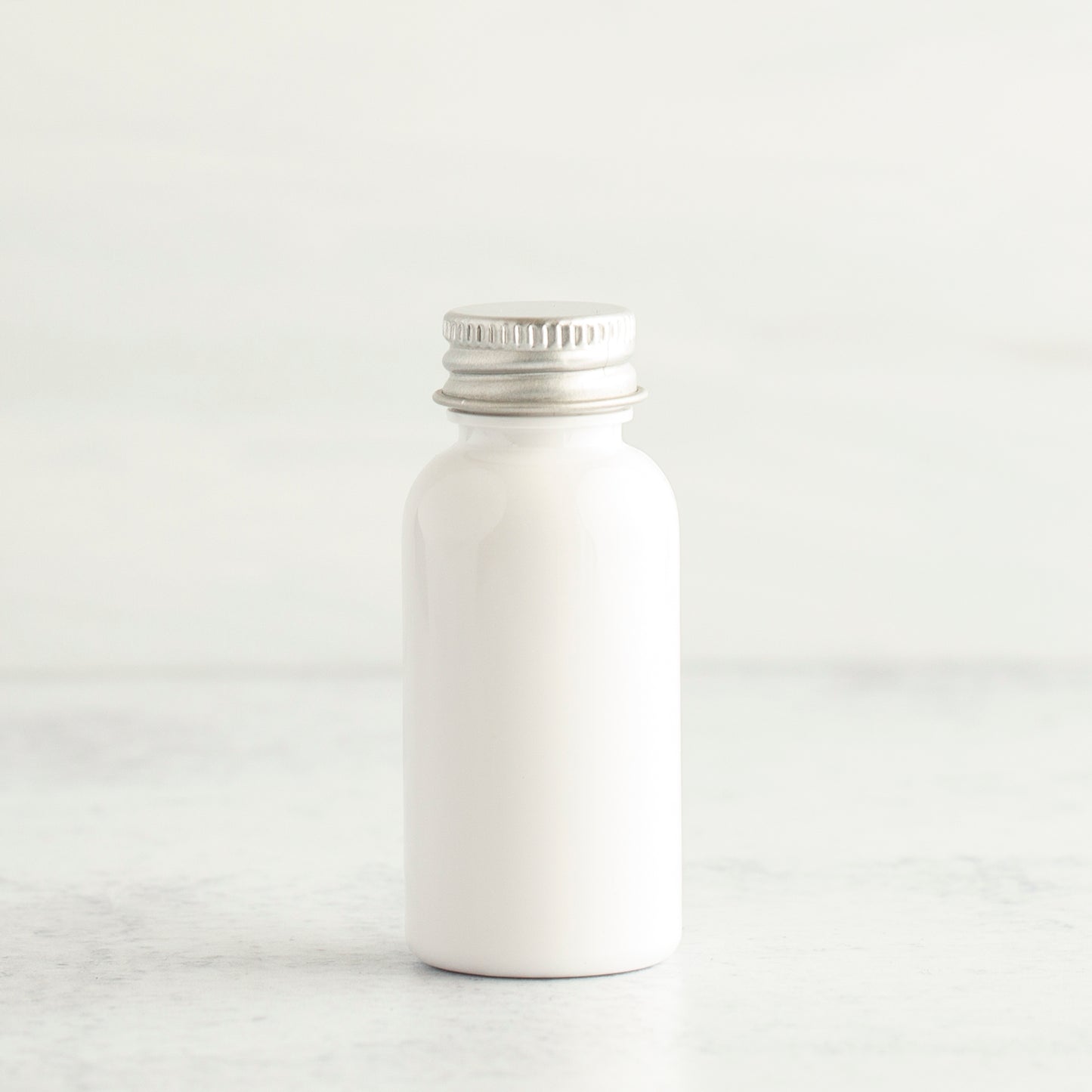 1 oz White PET Boston Round Bottle with 20-410 Aluminum Cap