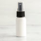 1 oz White PET Boston Round Bottle with 20-410 Black Fine Mist Sprayer