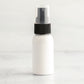1 oz White PET Boston Round Bottle with 20-410 Black Treatment Pump
