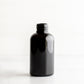 2 oz Black PET Boston Round Bottle Without Closure