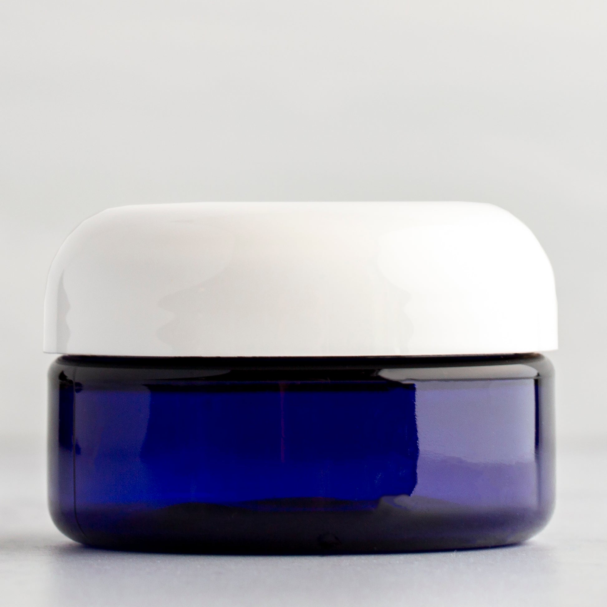 2 oz Blue Shallow Plastic Jar with White Dome Cap