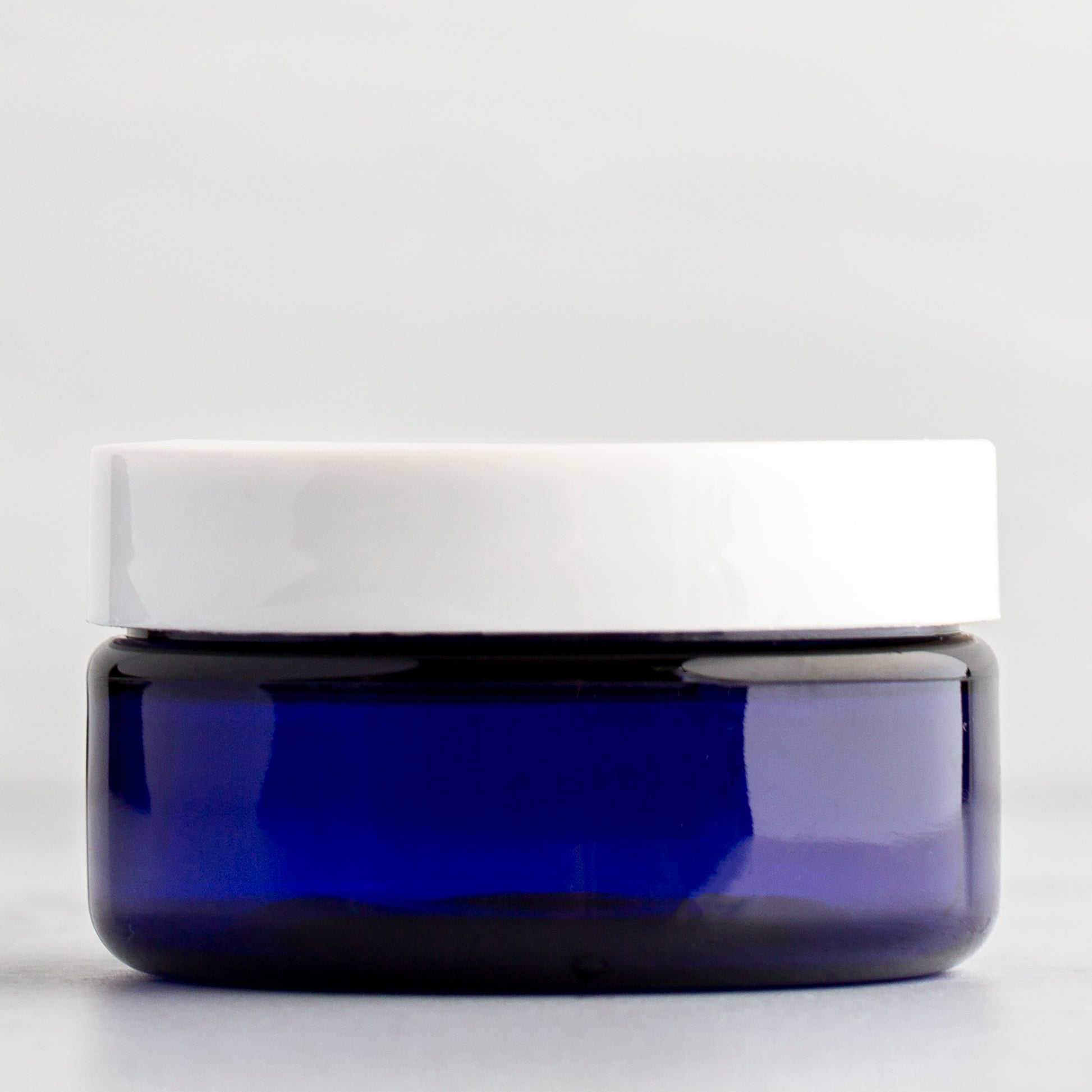 2 oz Blue Shallow Plastic Jar with White Flat Gloss Cap