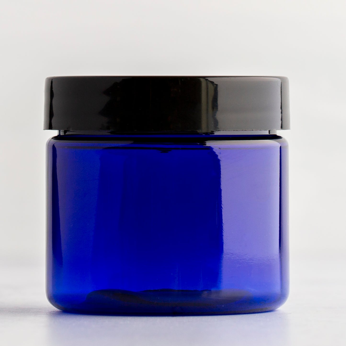 2oz Blue Straight Side Plastic Jar with Black Flat Gloss Cap