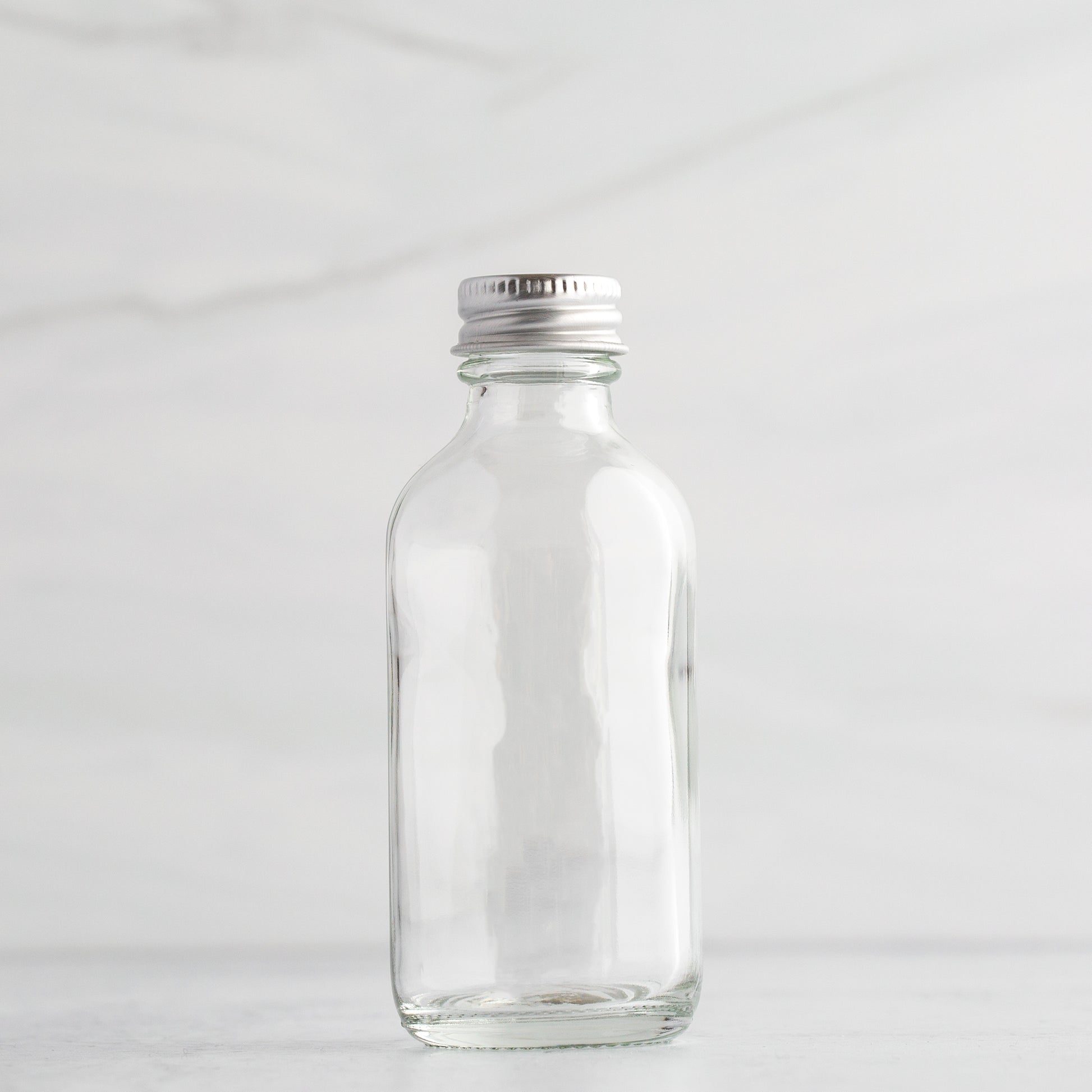 2 oz Clear Glass Bottle with Aluminum Cap