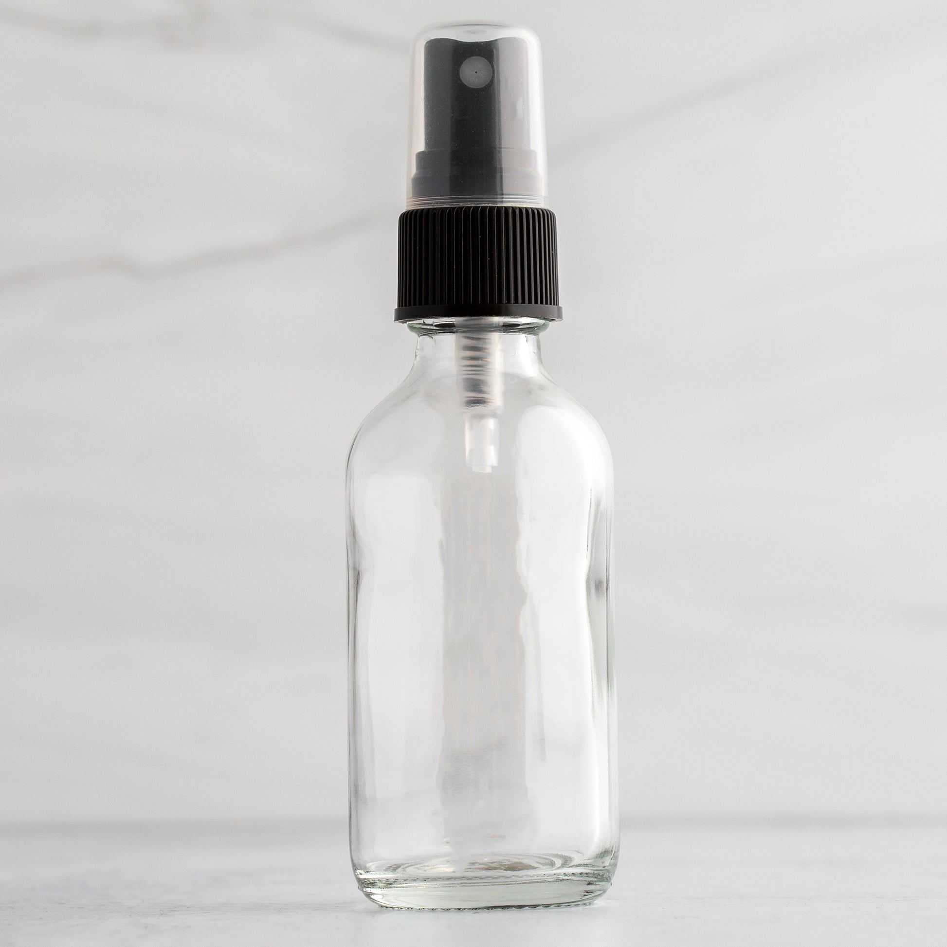 2 oz Clear Glass Bottle with Black Mister