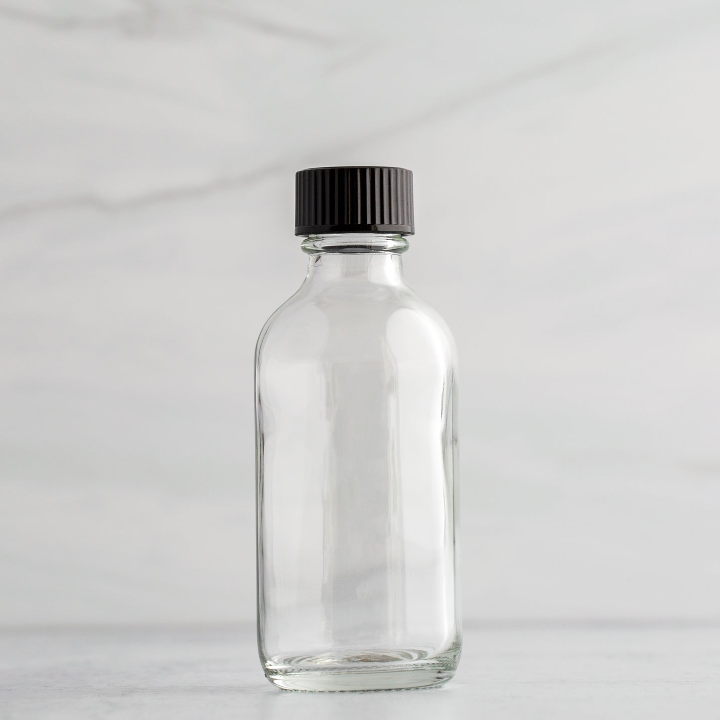 2 oz Clear Glass Bottle with Black Phenolic Cap