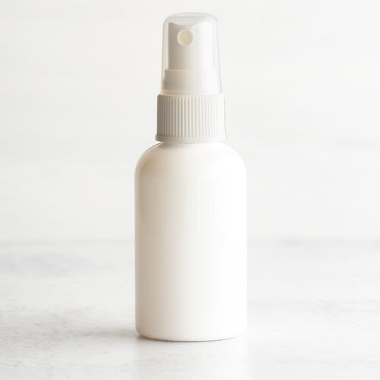 2 oz White PET Boston Round Bottle with 20-410 White Fine Mist Sprayer